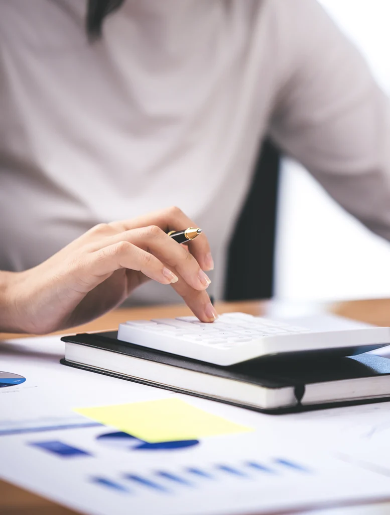 As part of a financial service package, a book keeper is inputting data about the clients finances.